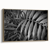 Framed wall art showcasing a botanical design with vibrant flowers and leaves, featuring a gold frame and a side view showcasing its elegant finish. Ideal for enhancing home decor.