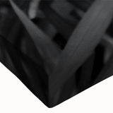 Close-up of a vibrant botanical wall art design featuring lush green leaves on stretched canvas, perfect for home decor and nature-inspired interiors.