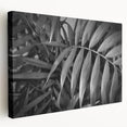 Stretched canvas wall art showcasing a vibrant botanical design with colorful flowers and leaves, perfect for adding a fresh, natural touch to home decor.