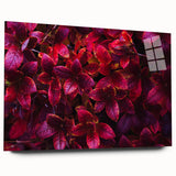 Acrylic glass wall art design featuring vibrant botanical leaves in a modern style, displayed from a side view, highlighting its sleek edges and colorful details.