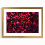 Elegant botanical wall art featuring a gold-framed design of vibrant flowers and leaves, perfect for home decor. Ideal for adding a touch of nature to any space.