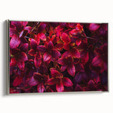 Framed wall art featuring a botanical design with vibrant flowers and leaves, showcased in a sleek silver frame, perfect for enhancing modern home decor.