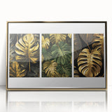 Framed wall art featuring a botanical leaves design in gold and green hues, elegantly displayed with an acrylic front, perfect for enhancing modern decor.