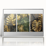 Framed wall art featuring a botanical design with vibrant green leaves and colorful flowers set against a white background, perfect for home decor.