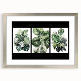 Botanical wall art featuring intricate floral and leaf designs in a silver frame with matting, ideal for home decor. Perfect for adding a touch of nature to any room.