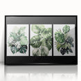 Framed wall art featuring a botanical design of vibrant flowers and leaves in a black frame, showcasing intricate details and colors for home decor.