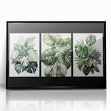 Framed wall art featuring a botanical design of vibrant flowers and leaves in a black frame, showcasing intricate details and colors for home decor.