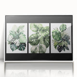 Framed botanical wall art print showcasing vibrant flowers and delicate leaves, presented in a sleek white frame, ideal for home decor enhancements.