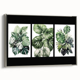 Framed botanical wall art collection showcasing vibrant flowers and leaves in a silver frame, ideal for adding a touch of nature to home decor.
