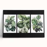 Stretched canvas artwork featuring a botanical design with vibrant flowers and lush green leaves, ideal for enhancing home decor with a nature-inspired aesthetic.