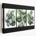 Stretched canvas wall art showcasing a botanical design featuring vibrant flowers and leaves in a side view, perfect for home decor and adding natural elegance.