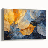 Framed botanical wall art featuring a vibrant collection of flowers and leaves in shades of green and silver, showcased from a side view on a neutral background.