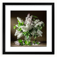 Black-framed wall art featuring a botanical design of lilacs, elegantly matted, showcasing vibrant purple flowers against a clean white background, perfect for floral decor.
