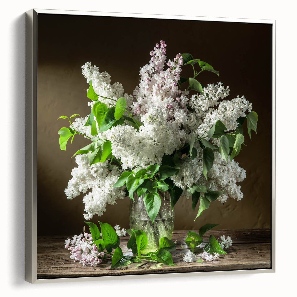 Framed canvas wall art showcasing a botanical design of lilacs in soft purple and green tones, elegantly displayed with a sleek silver frame, ideal for home decor.