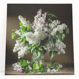 Stretched canvas wall art displaying a vibrant lilac floral design, showcasing intricate botanical details with rich purples and greens, perfect for home decor.