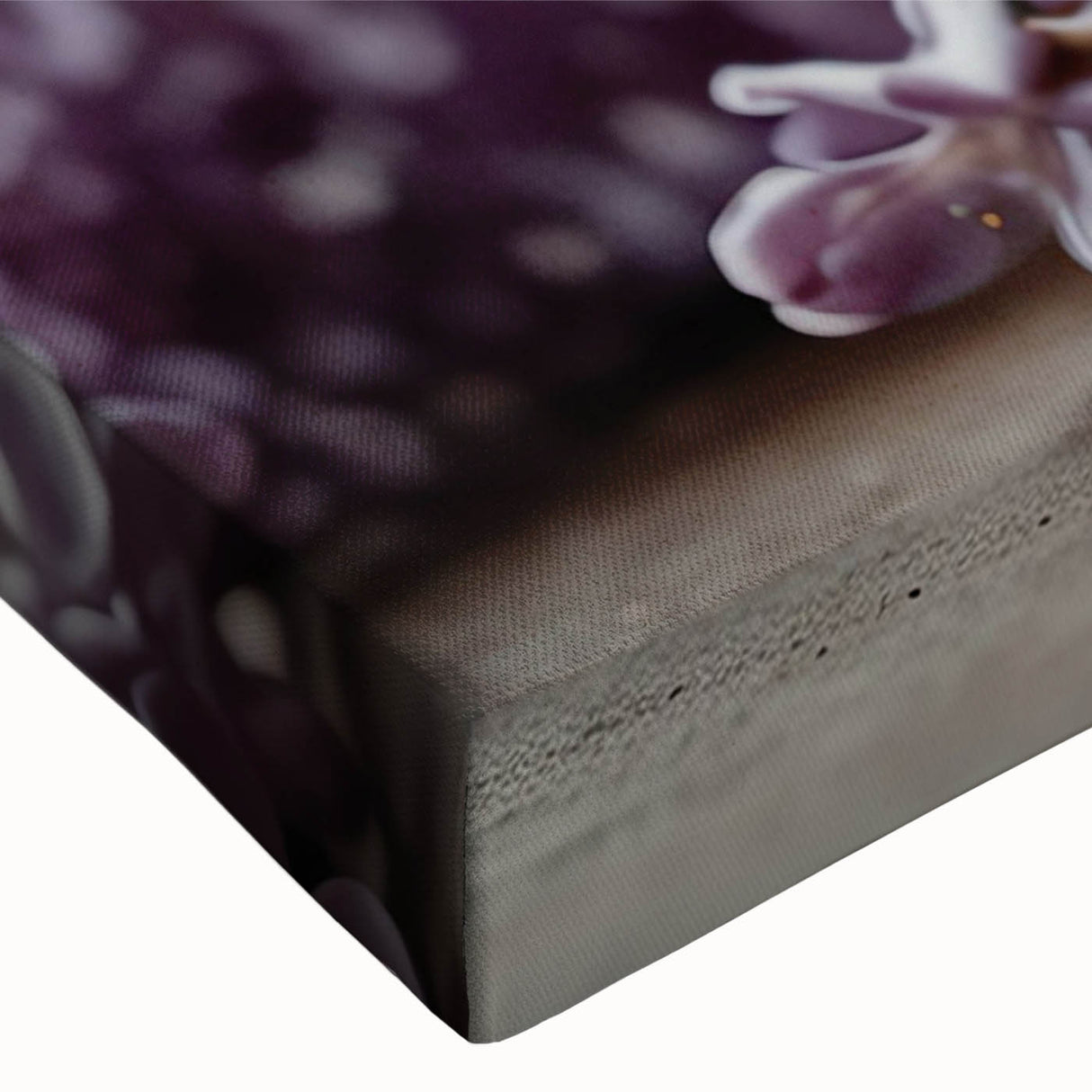 Close-up of a vibrant lilac botanical wall art design on stretched canvas, showcasing intricate floral details and rich purple hues, perfect for home decor.