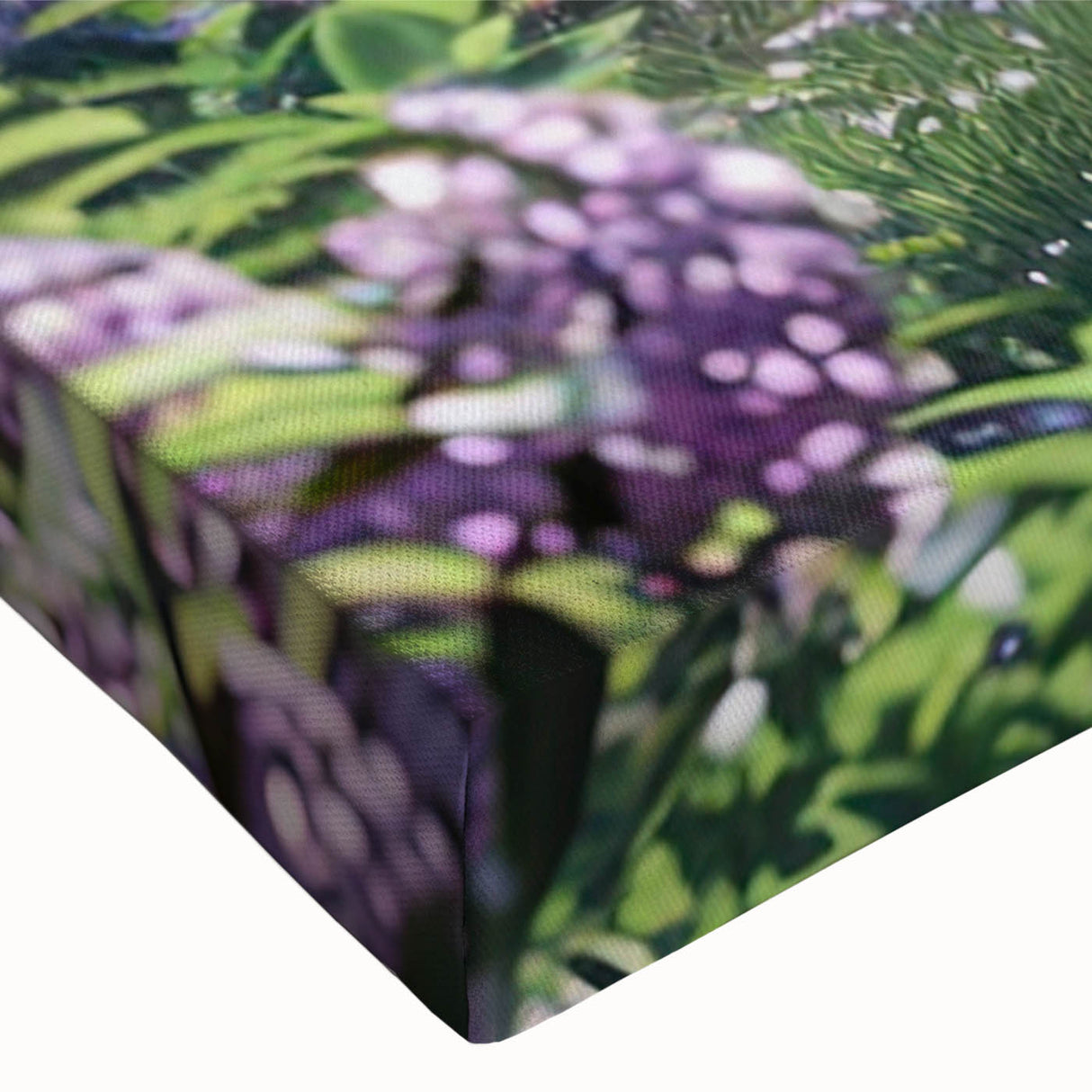 Close-up of a vibrant lilac floral design on stretched canvas, showcasing intricate details and rich colors, perfect for botanical-themed decor.