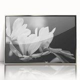 Framed acrylic wall art featuring a botanical magnolia design with a silver frame, showcasing vibrant floral details and elegant aesthetics for home decor.