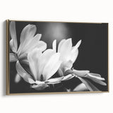 Framed canvas featuring a botanical magnolia design in gold tones, showcasing elegant floral details. Ideal for home decor with a touch of sophistication.
