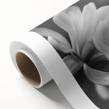 Botanical wall art featuring an elegant magnolia design on rolled canvas, showcasing soft pink and white flowers with green leaves, perfect for home decor.
