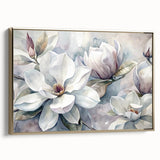 Framed wall art featuring a botanical magnolia design on canvas, showcasing delicate white flowers and green leaves, elegantly presented with a gold frame.