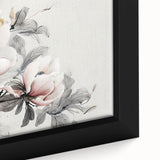 Close-up of a framed botanical wall art piece showcasing a delicate magnolia design with soft pink and white petals against a muted background, perfect for home decor.
