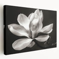 Stretched canvas wall art featuring a botanical design of magnolia flowers in soft pastel hues, displayed from a side view to highlight its depth and texture.