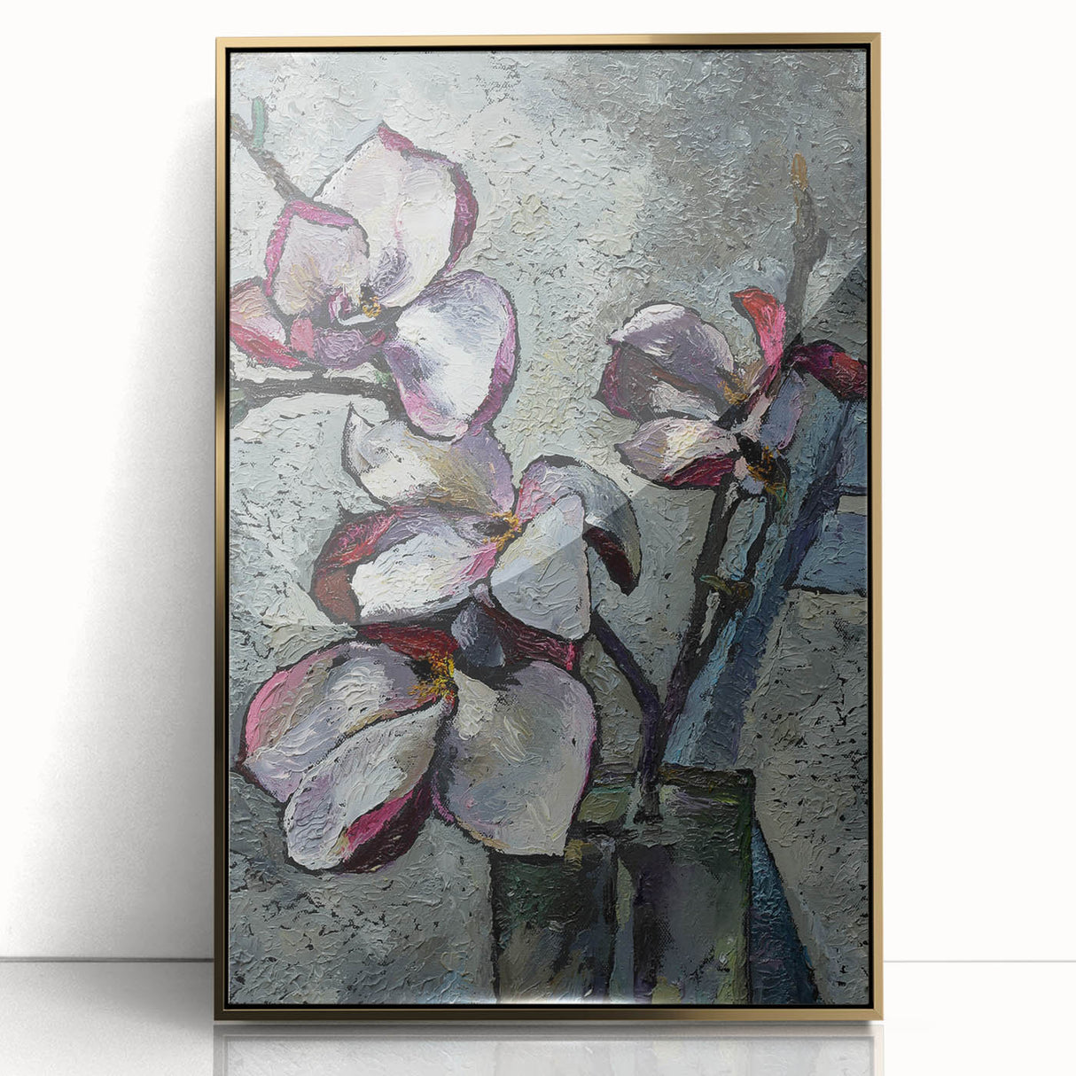 Framed botanical wall art featuring a magnolia design in soft pastel colors, encased in a sleek gold frame, perfect for enhancing home decor with elegance.