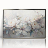 Framed wall art showcasing a botanical design of magnolia flowers in soft pink and white hues, elegantly displayed with a sleek silver frame, perfect for home decor.
