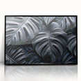 Framed wall art featuring a botanical monstera design, showcasing vibrant green leaves on a sleek black background, ideal for modern home decor.