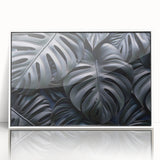 Framed acrylic wall art showcasing a botanical Monstera design with vibrant green leaves against a white background, ideal for modern home decor.