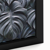 Close-up view of a vibrant framed canvas print showcasing a botanical Monstera design with lush green leaves, perfect for home decor and plant enthusiasts.