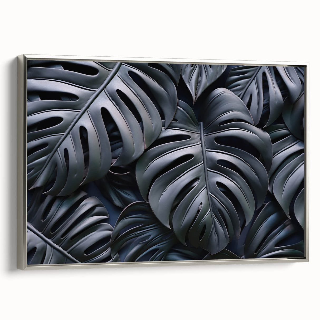 Framed canvas wall art featuring a vibrant botanical monstera design with silver detailing, displayed from the side in a stylish interior setting. Perfect for nature-inspired decor.