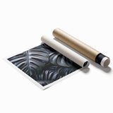 Vibrant botanical monstera wall art print showcasing lush green leaves against a clean white background, rolled and ready for framing or display. Perfect for nature-inspired decor.