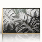 Framed wall art showcasing a botanical monstera design with vibrant green leaves set against a gold-acrylic background, perfect for modern home decor.