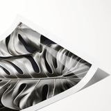 Botanical wall art print showcasing a vibrant Monstera leaf design on a textured background, rolled and ready for display in any modern decor setting.