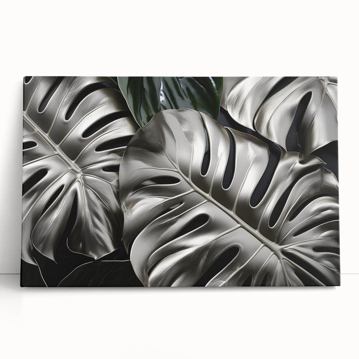 Botanical monstera wall art featuring lush green leaves on a stretched canvas, elegantly leaning against a neutral-colored wall, enhancing modern decor aesthetics.