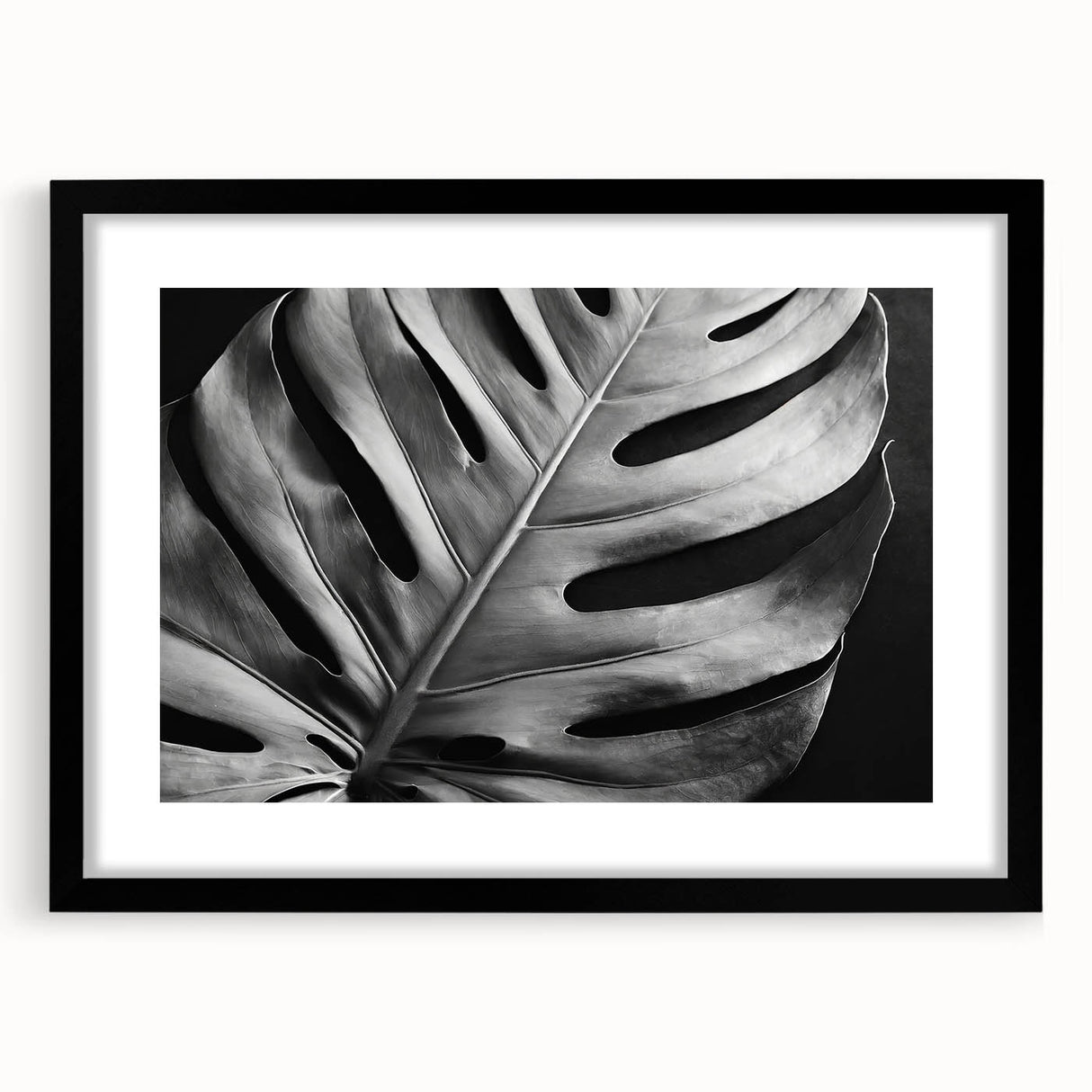 Framed botanical wall art featuring a Monstera plant design, set in a sleek black frame with a mat, perfect for modern home decor and nature enthusiasts.