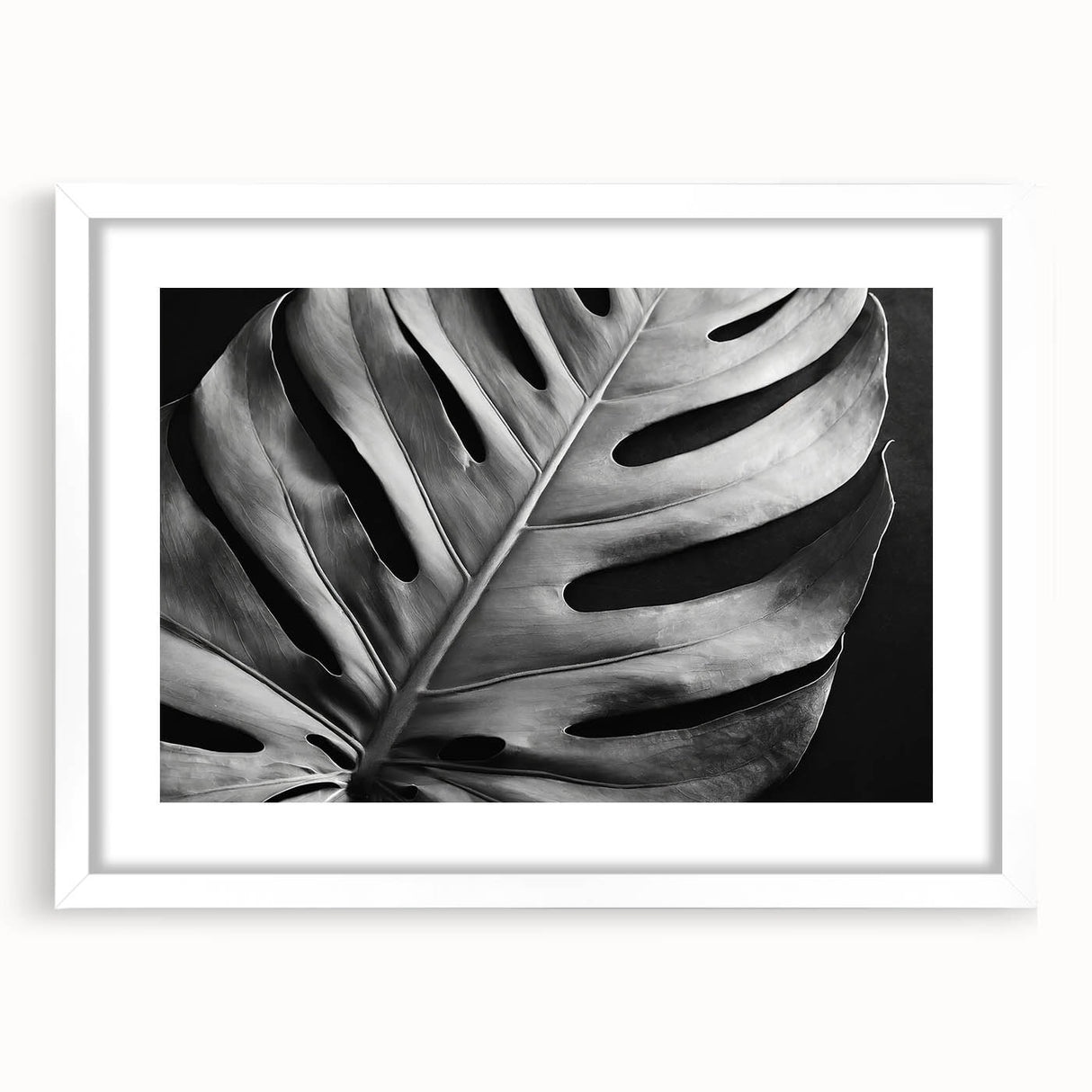 Framed botanical wall art featuring a vibrant monstera leaf design on a white background, ideal for adding a touch of nature to any room decor. Perfect for plant lovers and modern home aesthetics.