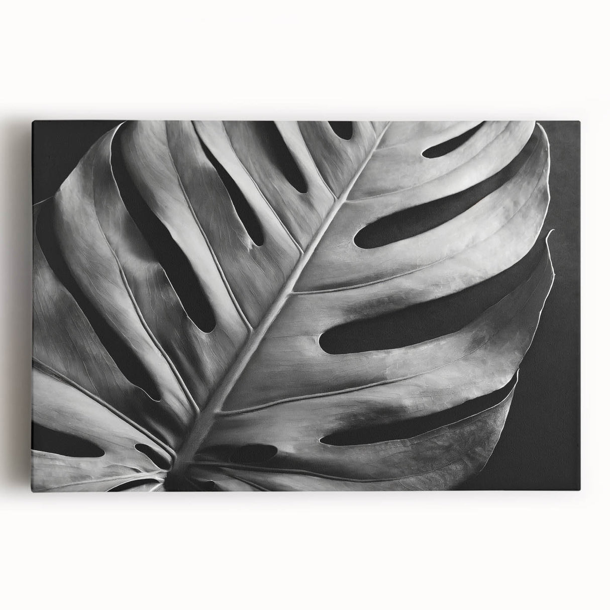 Stretched canvas wall art featuring a vibrant botanical monstera design with lush green leaves against a neutral background, ideal for enhancing modern home decor.