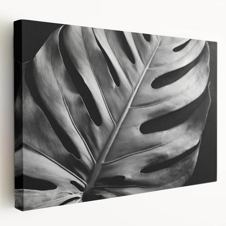 Stretched canvas wall art showcasing a vibrant botanical Monstera design, featuring lush green leaves against a neutral background, perfect for home decor.