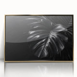 Framed botanical wall art featuring a Monstera leaf design in vibrant green tones, presented in an elegant gold frame, perfect for home decor enhancement.