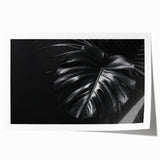 Botanical wall art print featuring a vibrant Monstera leaf design in shades of green, elegantly rolled for easy display and storage, perfect for home decor.