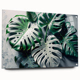 Acrylic wall art design showcasing a vibrant monstera plant illustration, displayed with decorative pins against a textured background, ideal for botanical decor enthusiasts.