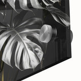 Close-up of a vibrant botanical wall art piece featuring a Monstera plant design, showcasing intricate leaf details and a glossy acrylic finish, perfect for home decor.