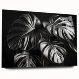 Acrylic glass wall art collection showcasing a botanical monstera design, featuring vibrant green leaves on a sleek surface. Ideal for home decor enhancement.