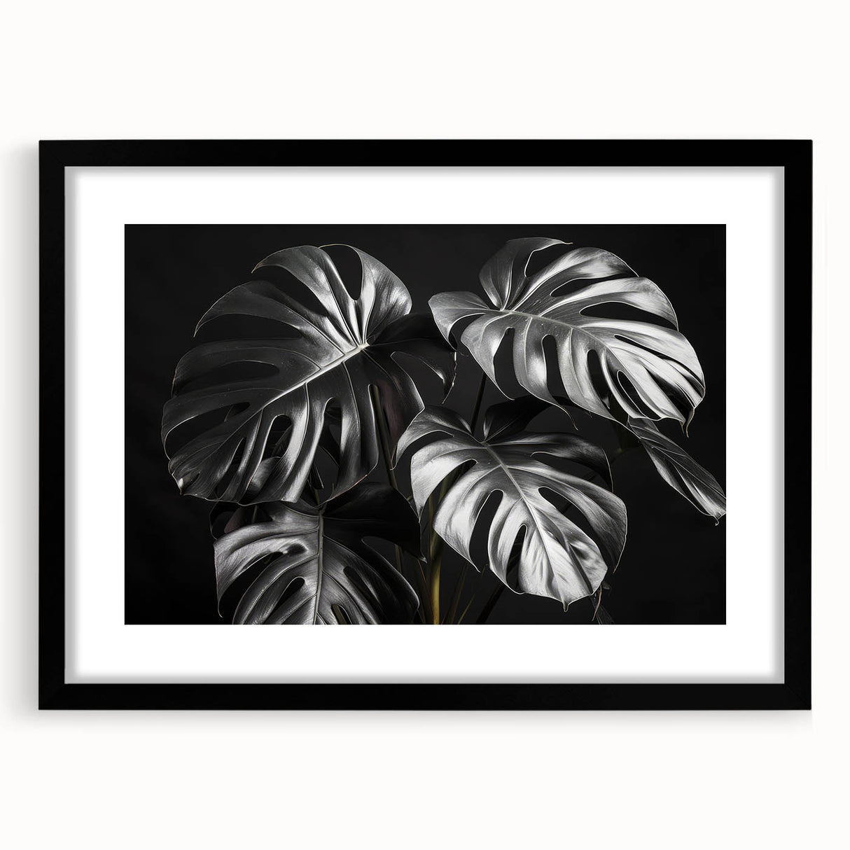 Framed botanical wall art collection featuring a Monstera leaf design with a black frame and mat, ideal for modern home decor and nature enthusiasts.