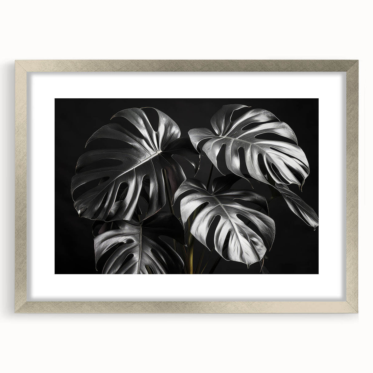 Botanical wall art collection featuring a silver-framed Monstera design, showcasing vibrant green foliage and elegant matting, perfect for home decor enhancement.