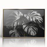 Framed botanical wall art featuring a Monstera plant design with a gold acrylic front; perfect for adding a touch of nature-inspired elegance to home decor.