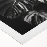 Botanical wall art featuring a vibrant monstera leaf design on rolled canvas, showcasing lush green hues and detailed textures, ideal for home decor.